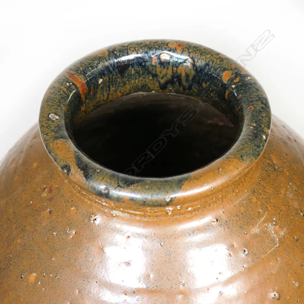 Warren Tippett large floor vase, tenmoku glaze w band of impressed design around middle, made in coromandel, stamped. H. Image 1++