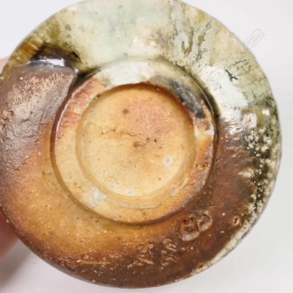 Bruce Martin (-2023) anagama Tea Bowl. Japanese 'shino' style with pale green over-glaze. Maker's mark to base. H.120mm. Image 1++