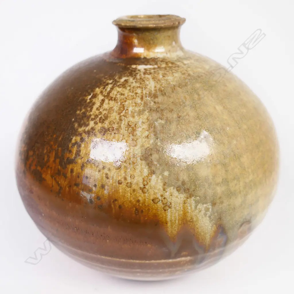 Estelle Martin anagama ovid vase with single lug on shoulder. Green & brown glazes. Mark to base. H 140mm. Image 1++