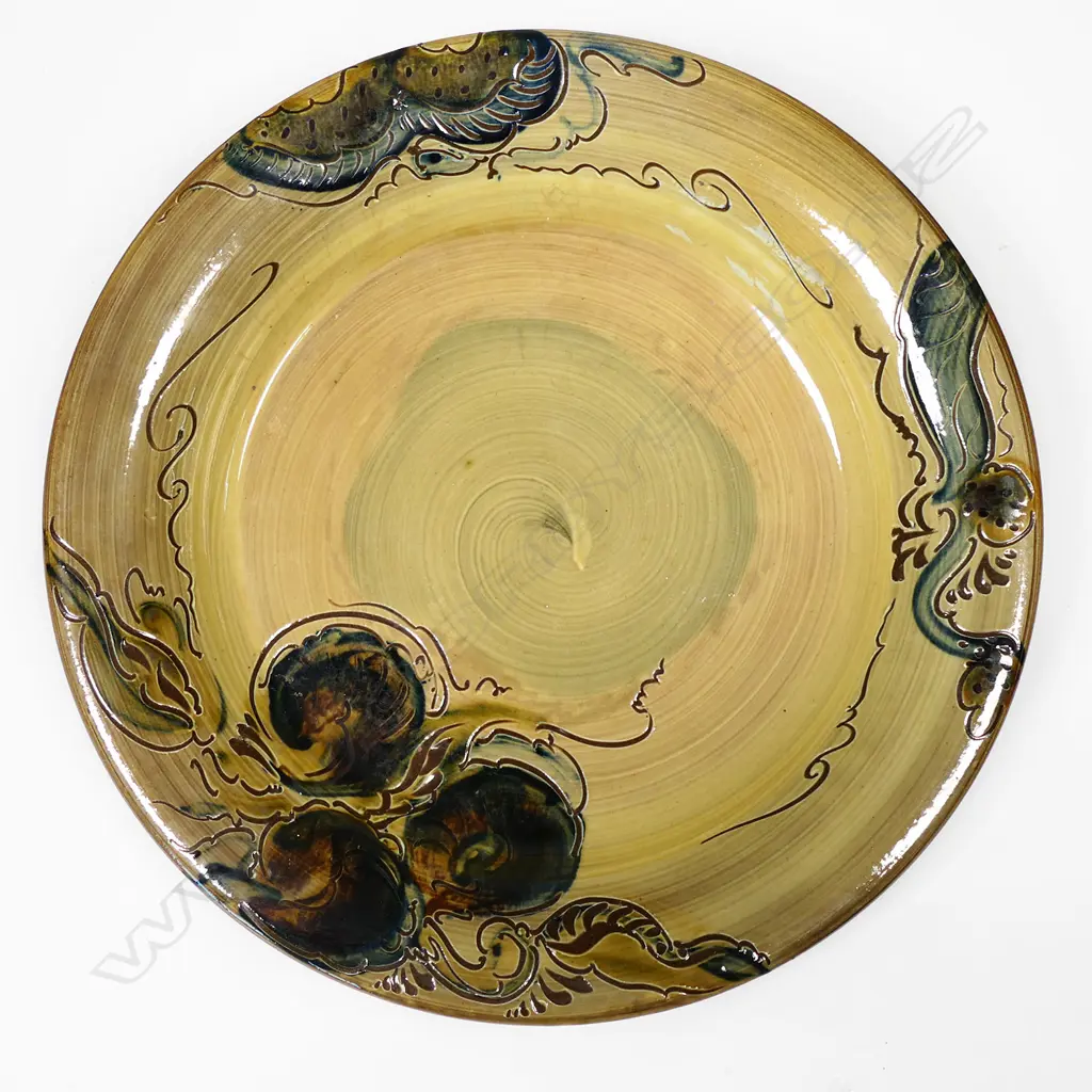 John Anderson lrg 1970s charger, ocre glaze w floral swirls, signed to base, Dia.340mm Image 1++