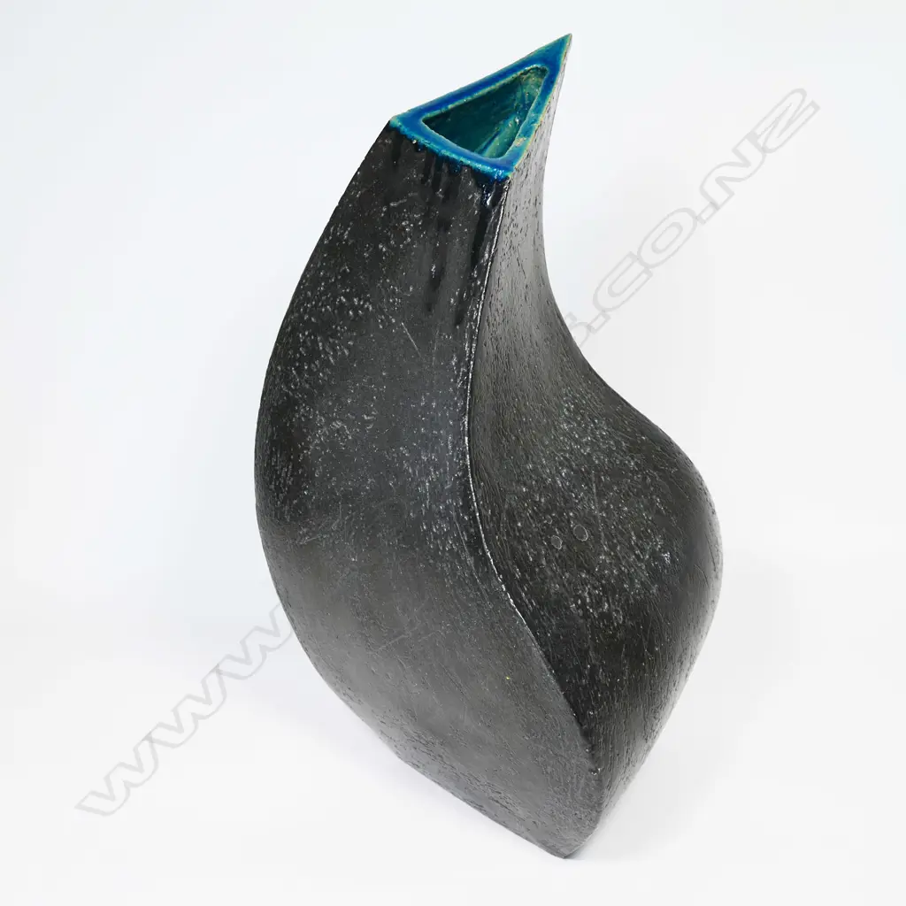 Graham Ambrose large 'Three Quarter Pot' with satin black glaze and blue gloss highlight to the rim and interior. The turning form with four sided base and three sided top. Incised potters mark to base. H.540mm, Image 1++