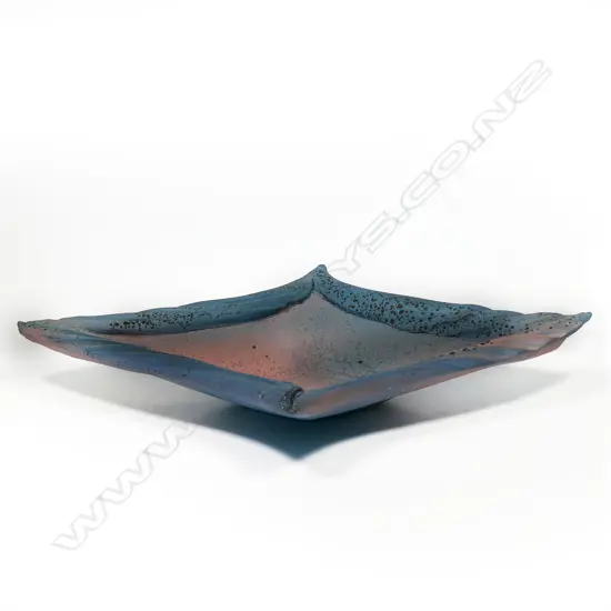 A large and heavy lozenge-shaped bowl by Merilyn Wiseman. Large rolled and textured edges