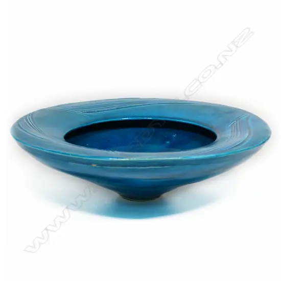 Merilyn Wiseman Large Blue Bowl With Wide Flanged Lip. The wide flange has a combed decoration under the glaze