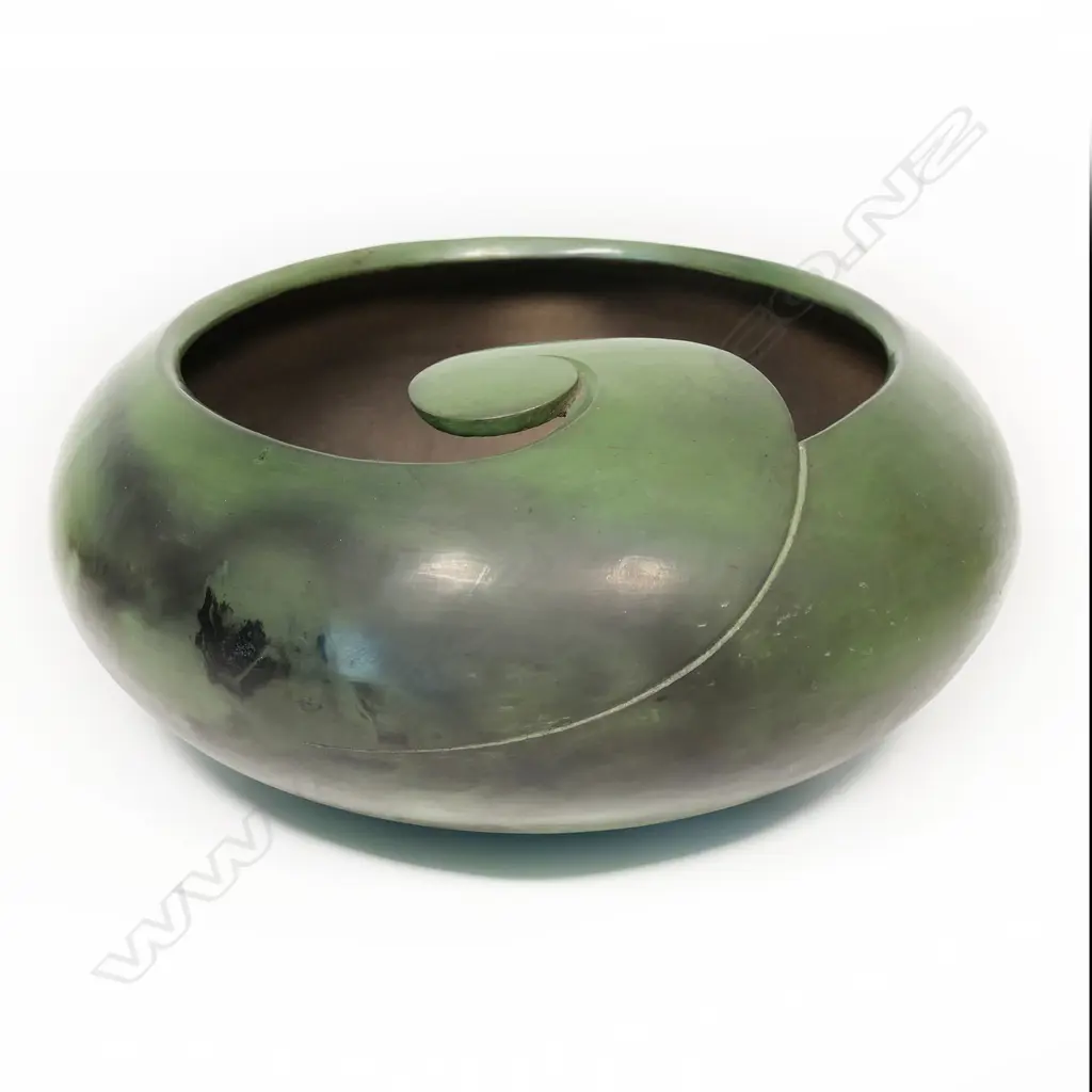 A rare Robyn Stewart (1938-2018) large jade green koro form bowl. Dia.400mm. Dung fired raku, jade green burnished with matte finish; the rim modelled in a Koru design Image 1++