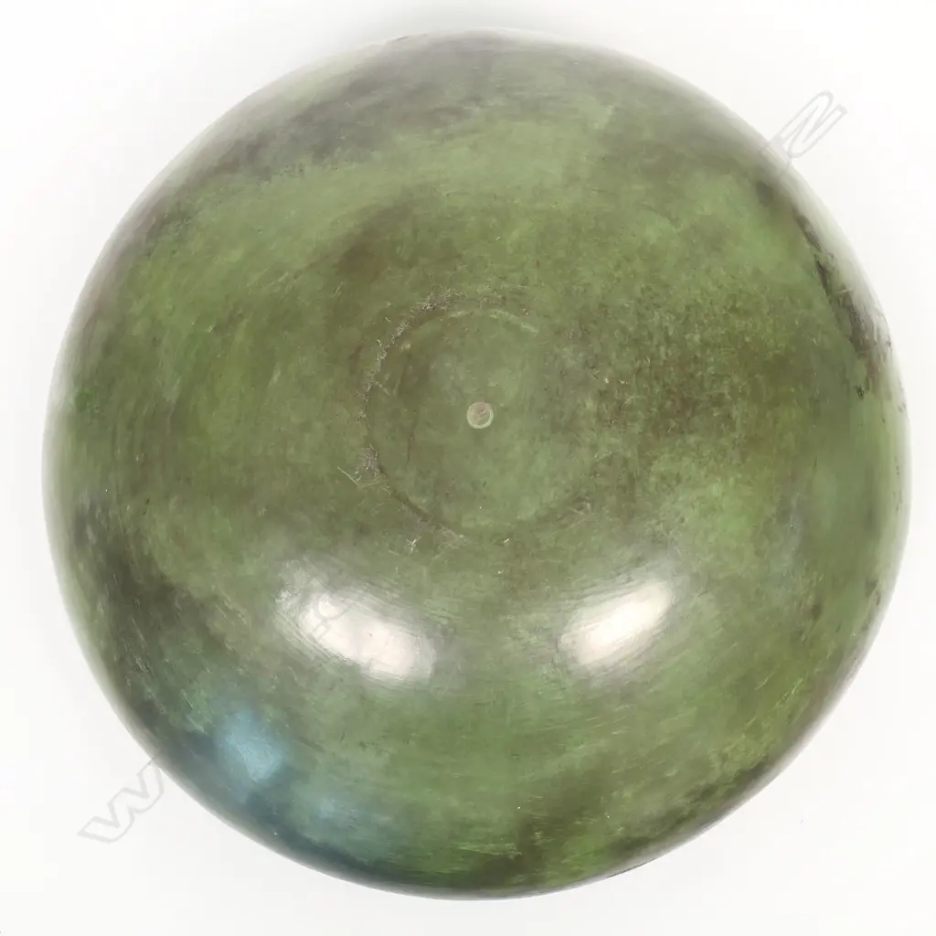 A rare Robyn Stewart (1938-2018) large jade green koro form bowl. Dia.400mm. Dung fired raku, jade green burnished with matte finish; the rim modelled in a Koru design Image 1++