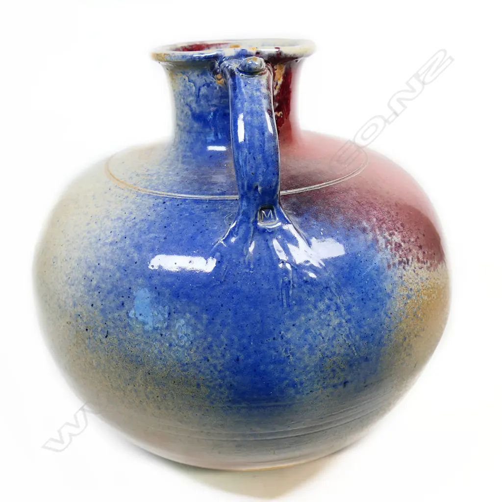 (F20A) Murray Garner red copper glazed floor standing vessel w handle. H 370mm. Image 1++