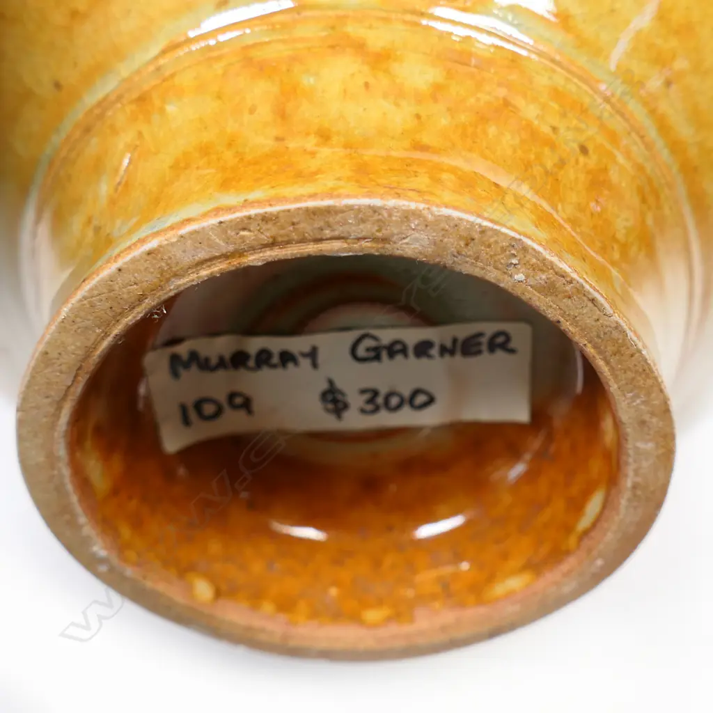 (F20B) Murray Garner red copper glazed pot w handle. H 340mm. Image 1++