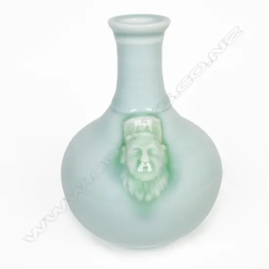 Steve Aitken porcelain celadon glaze vase mask to shoulder. H.148mm.