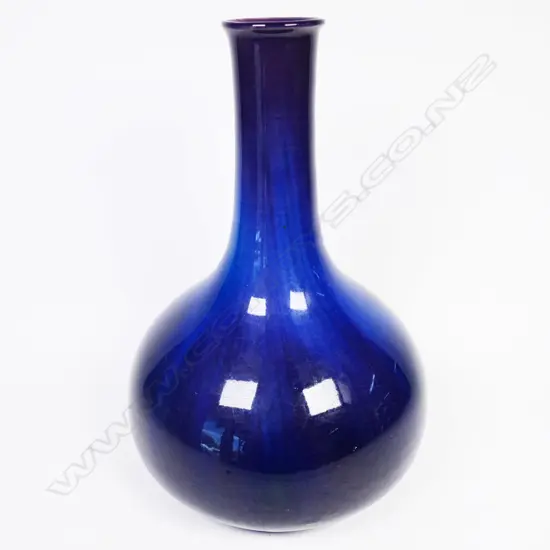 An early 1900s Ashby Guild vase bottle form in cobalt blue glaze