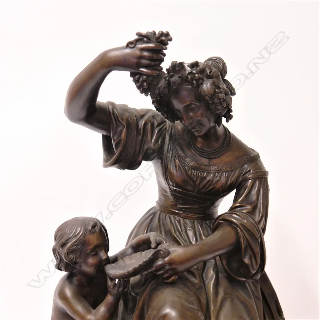 A Victorian bronze of a young woman with cherub tasting the new wine Image 1++