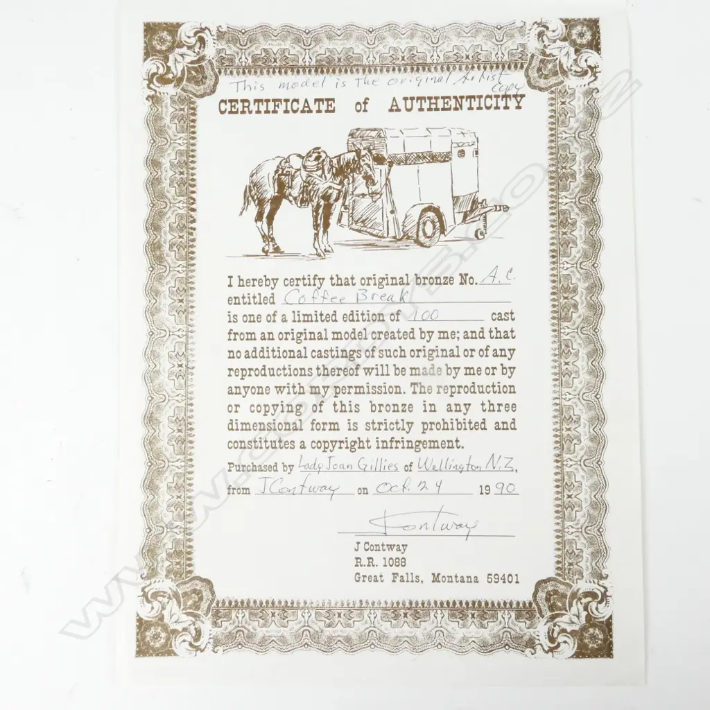 A small original bronze figure of a seated cowboy Image 1++