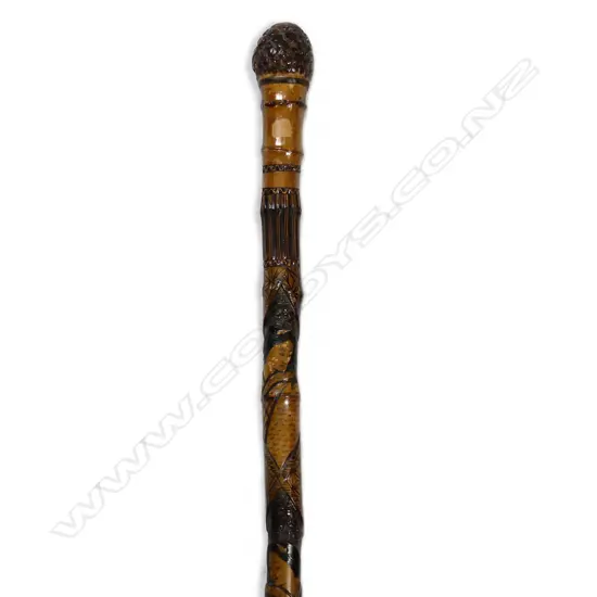 A carved Japanese bamboo walking stick