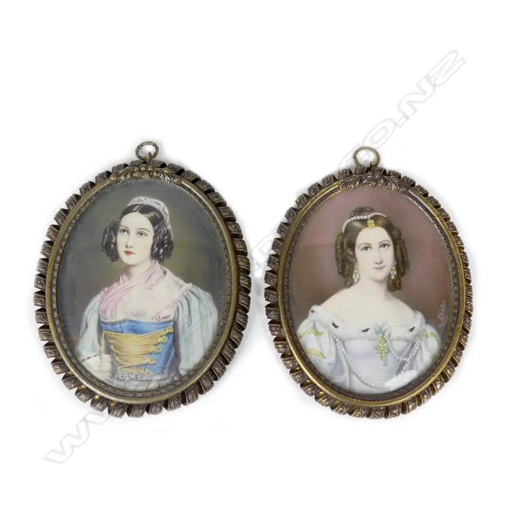 A pair of hand painted portrait miniatures on ivory Image 1++