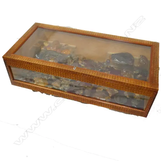 A carved kauri display cabinet