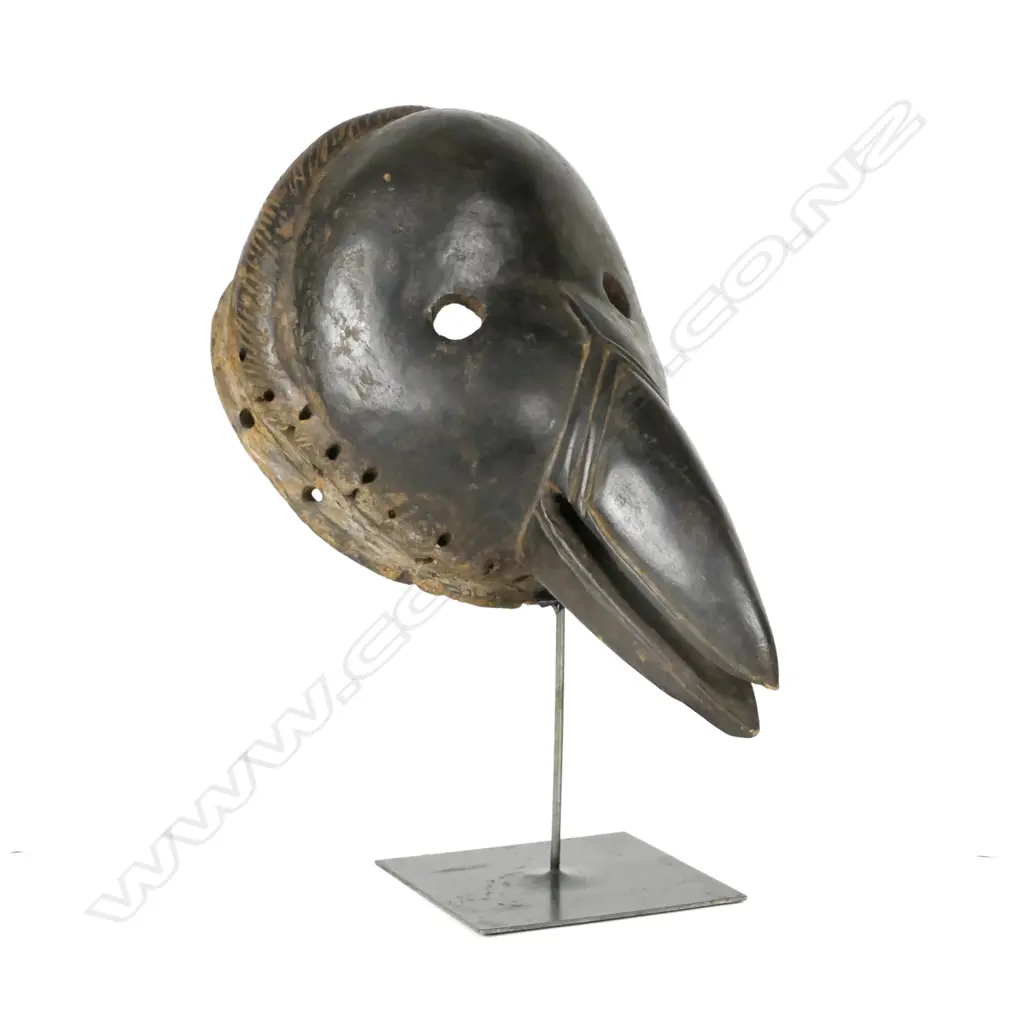 A carved Congolese tribal bird mask Image 1++