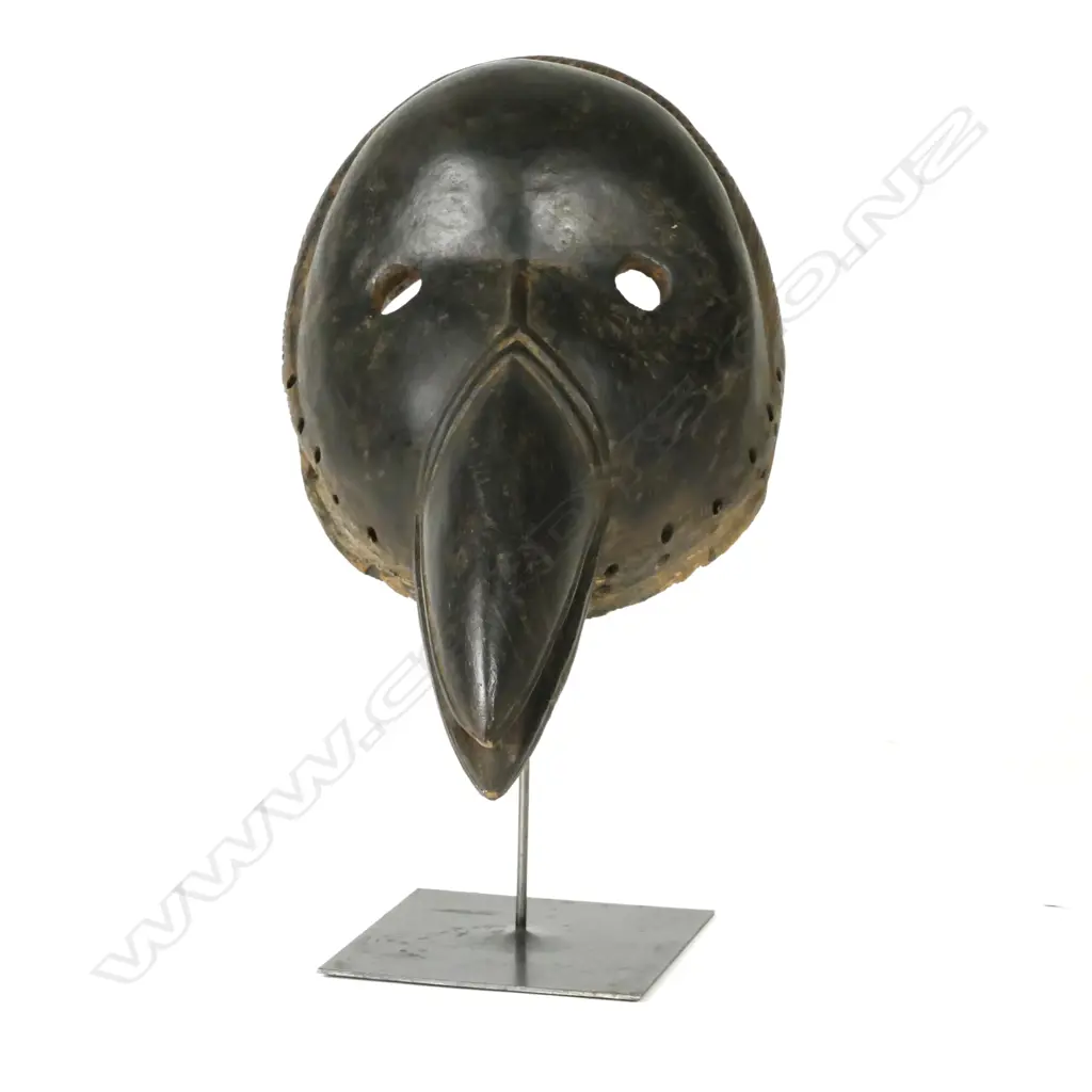 A carved Congolese tribal bird mask Image 1++