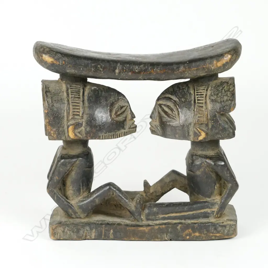 A carved Hemba tribal headrest Image 1++