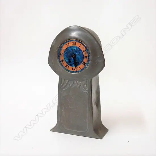 A c.1900-1910 Liberty & Co. Tudric pewter and enamel clock designed by Archibald Knox