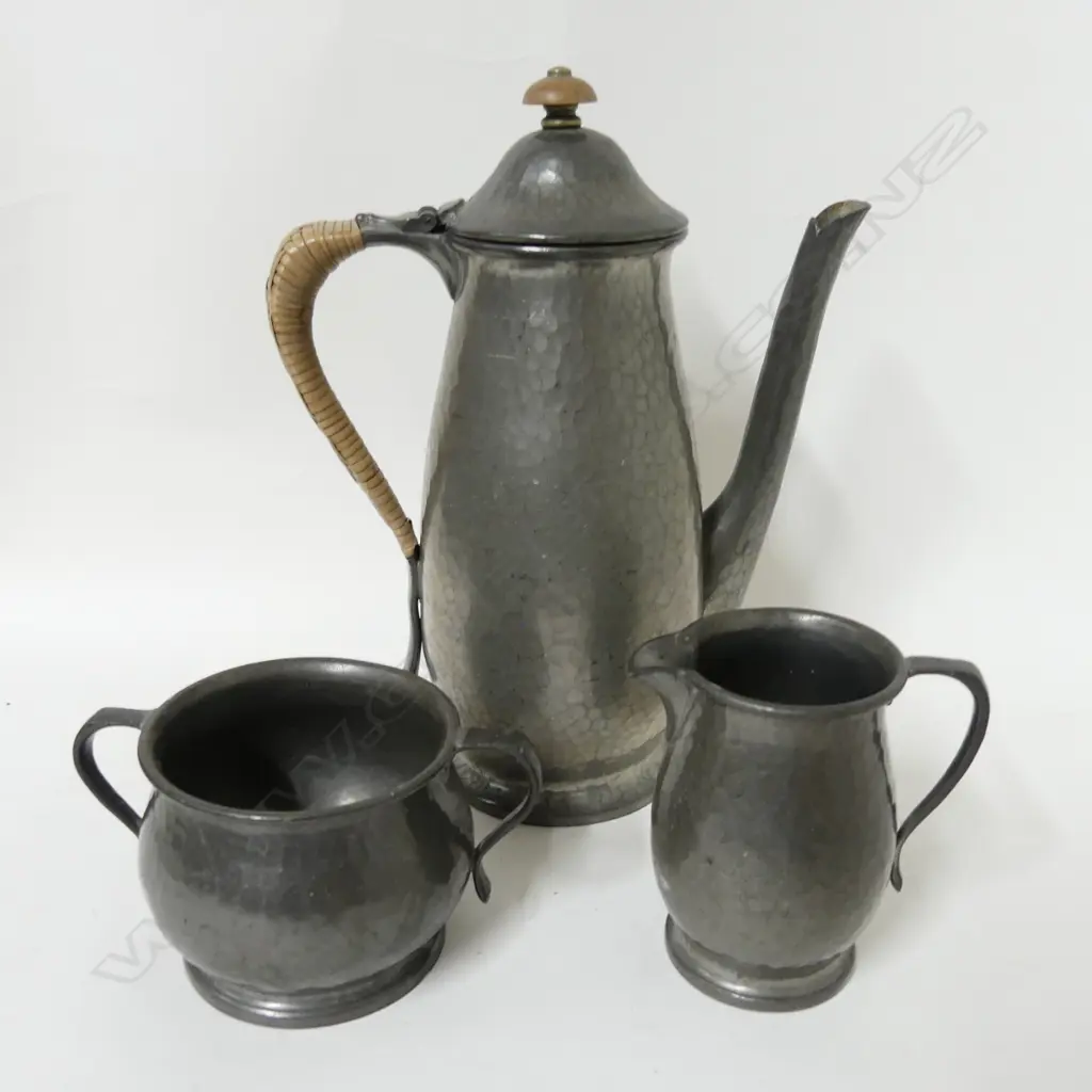 A three piece Tudric pewter coffee set Image 1++