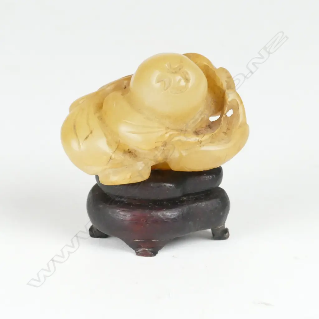 A small Chinese greenish-brown jade fingering piece Image 1++