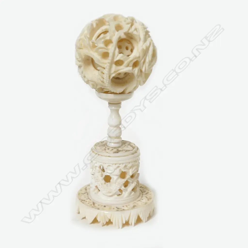 A small ivory carved puzzle ball Image 1++