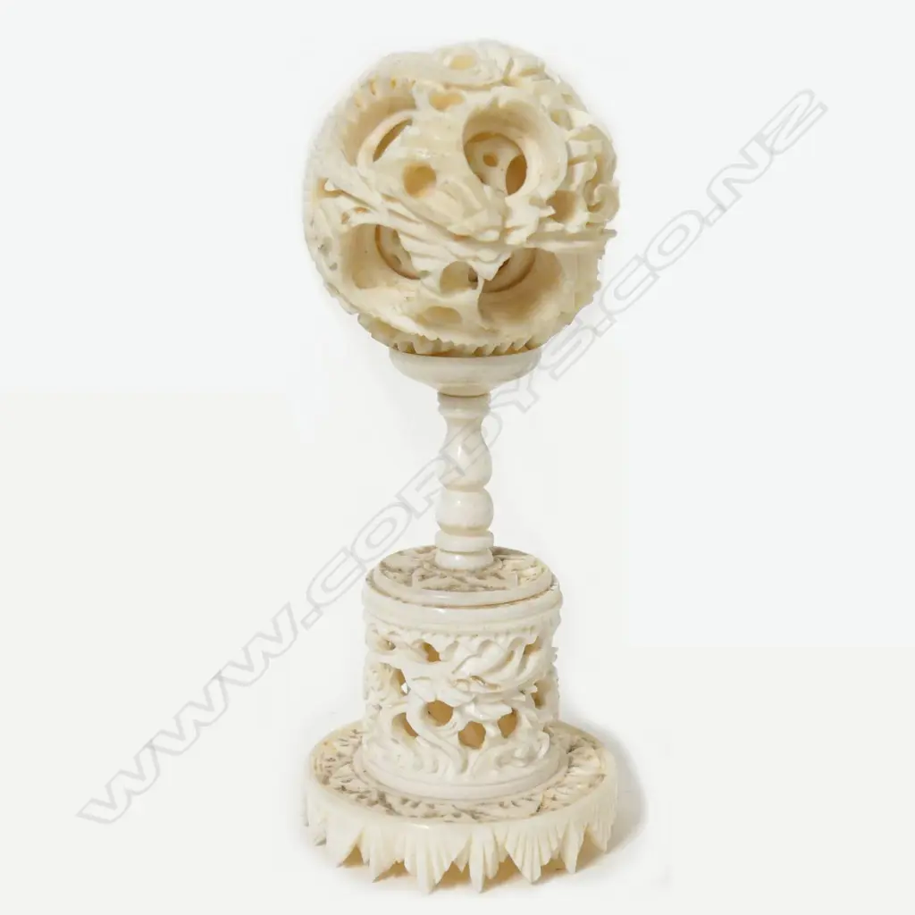 A small ivory carved puzzle ball Image 1++