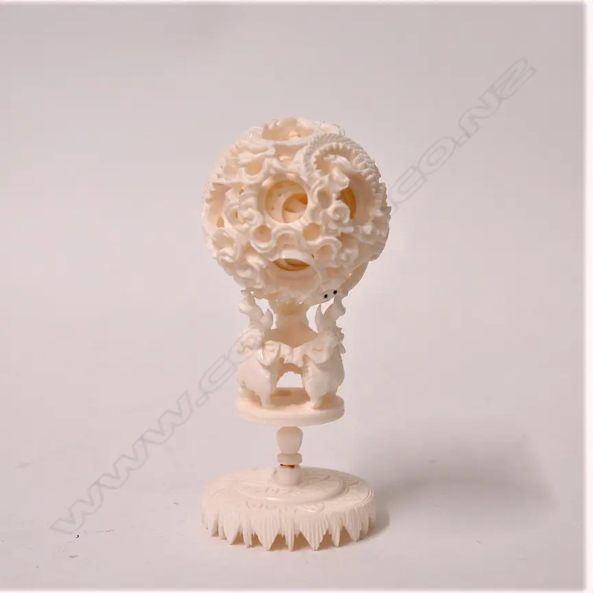 A vintage Chinese carved ivory puzzle ball on elephant stand Image 1++