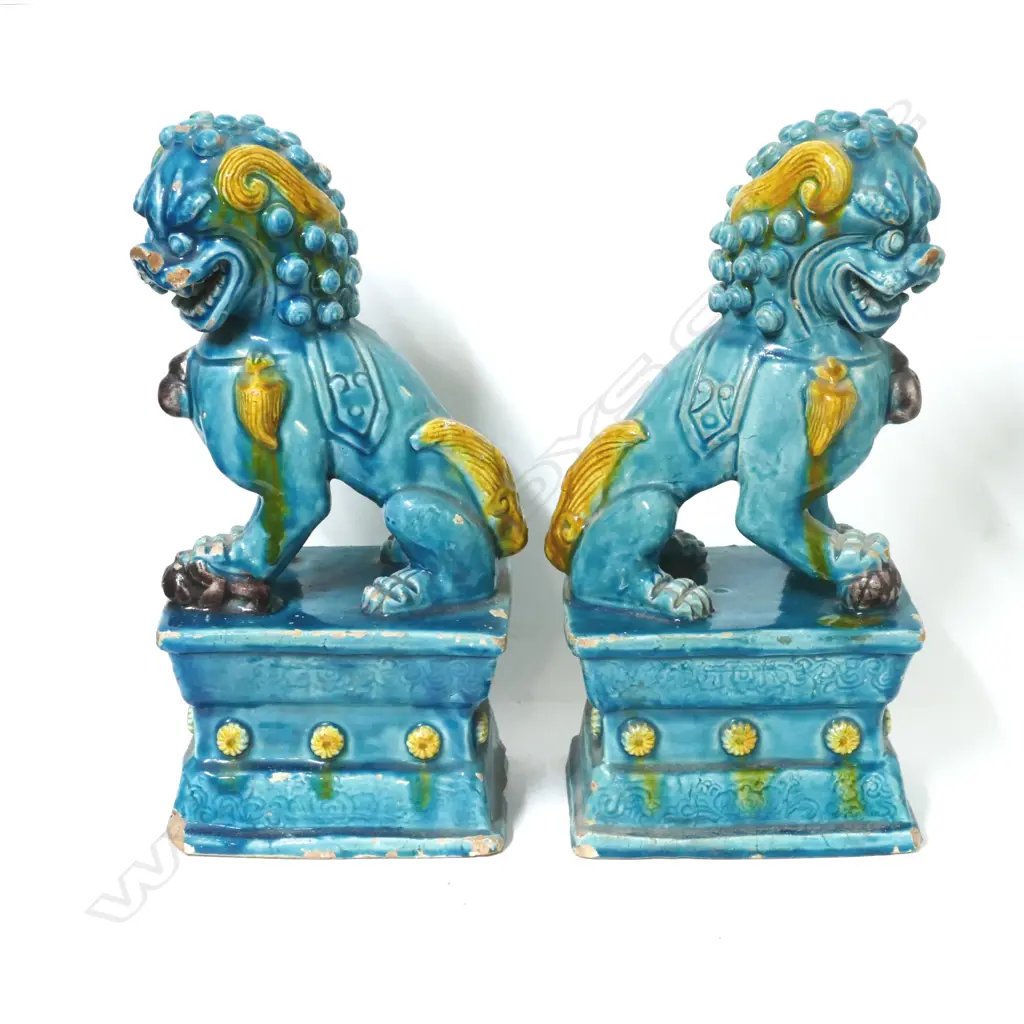 A pair of old Chinese glazed pottery kylins on plinth bases Image 1++