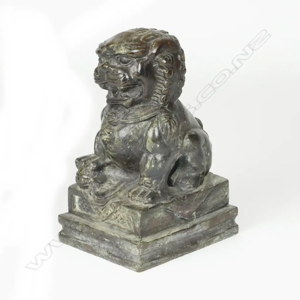 A Chinese bronze figure of a crouching kylin Image 1++