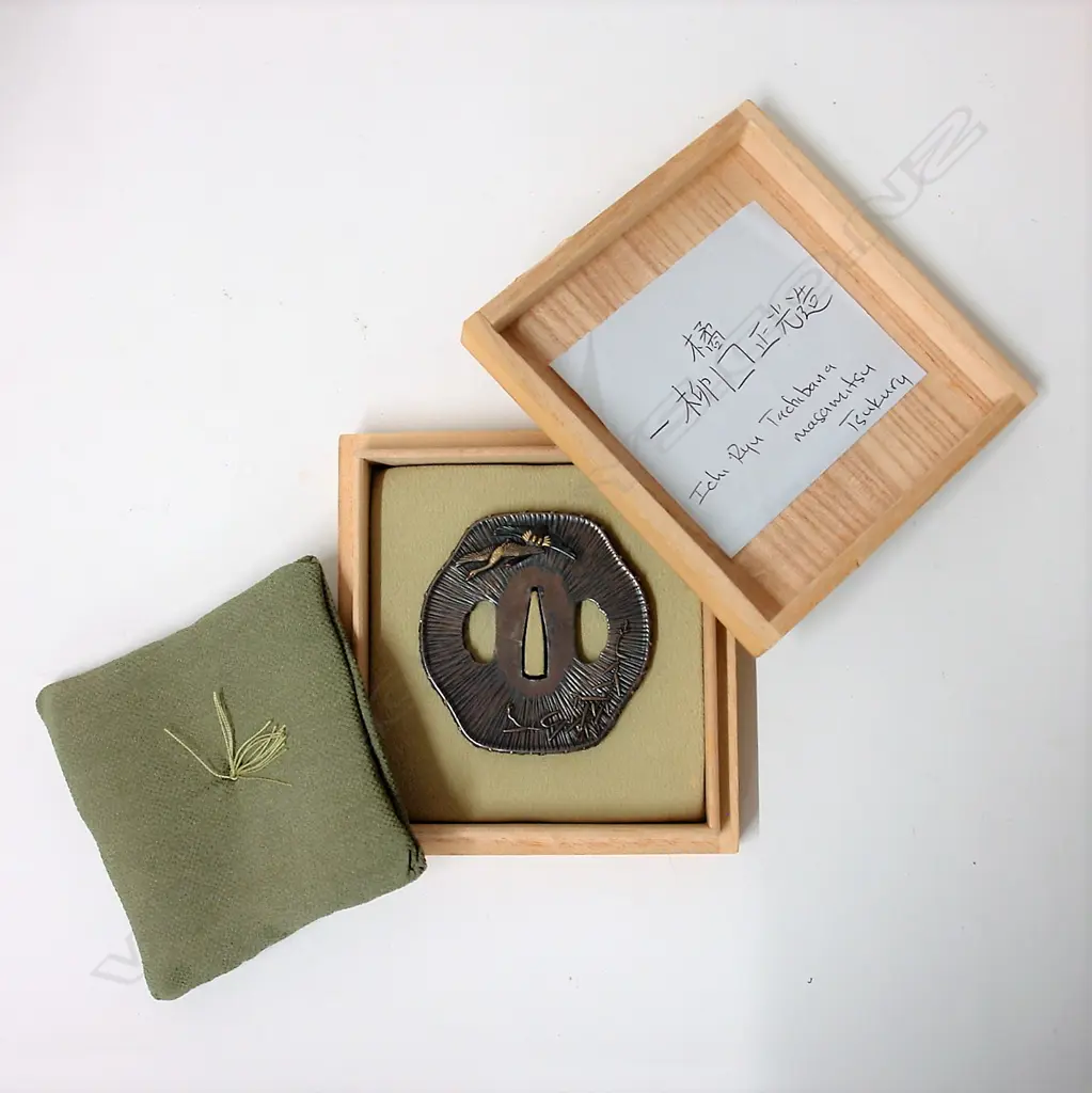 A fine and rare Japanese silver sword tsuba Image 1++