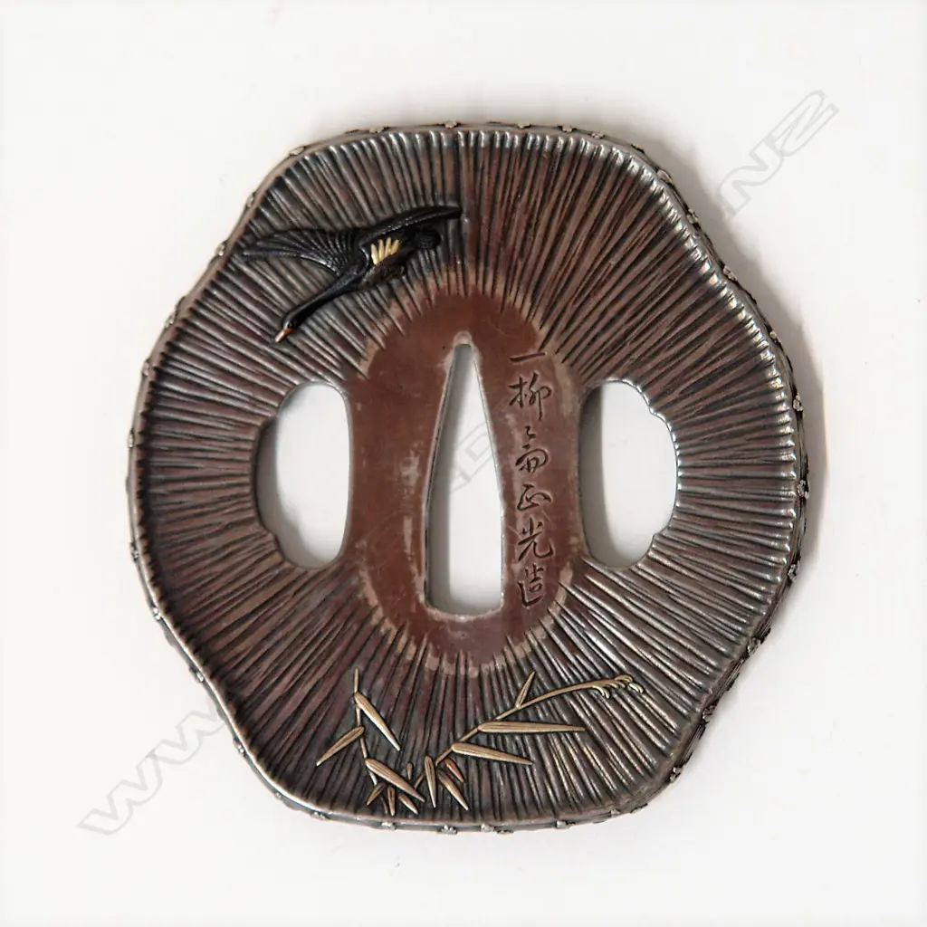 A fine and rare Japanese silver sword tsuba Image 1++
