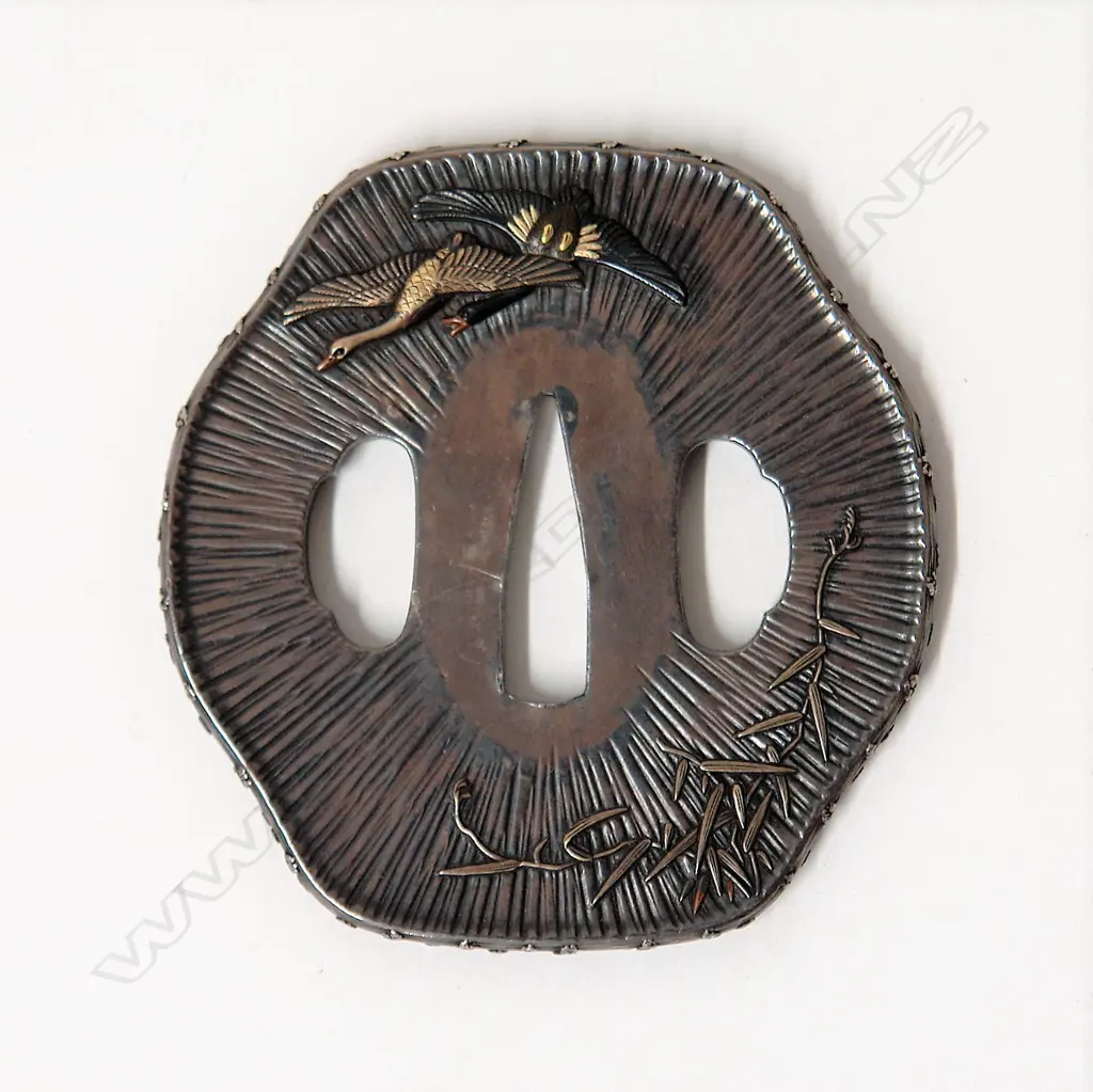 A fine and rare Japanese silver sword tsuba Image 1++