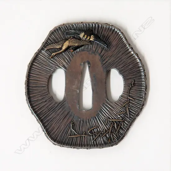 A fine and rare Japanese silver sword tsuba