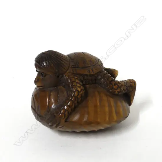 A Japanese carved boxwood netsuke