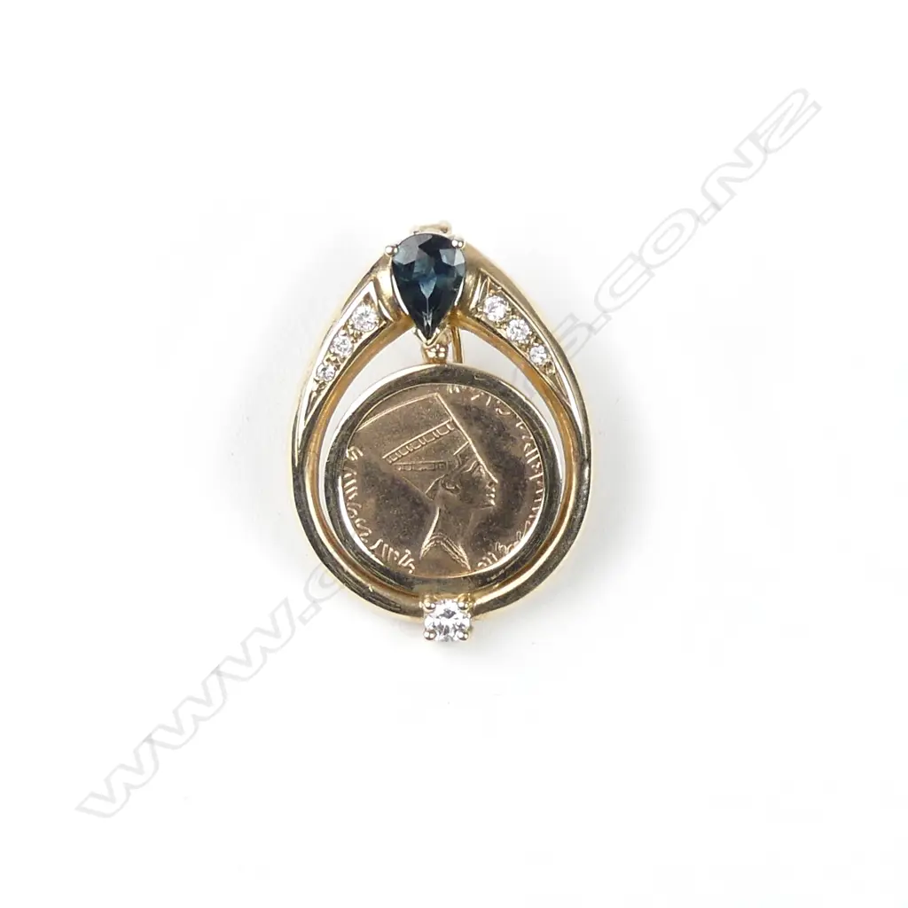 A 9ct. gold diamond and sapphire set pendant Image 1++