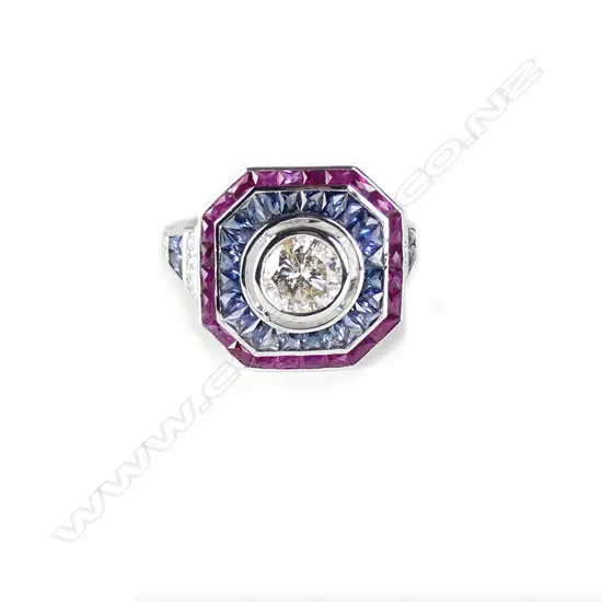 An 18ct. white gold diamond ruby and sapphire Art Deco style ring