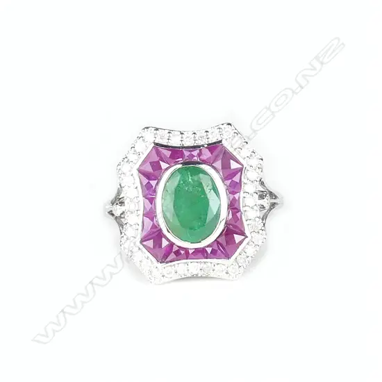 An 18ct. white gold emerald ruby and diamond Art Deco style ring