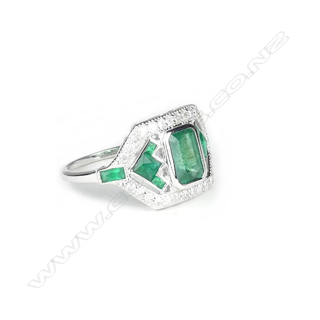 An 18ct. white gold emerald and diamond Art Deco style ring Image 1++