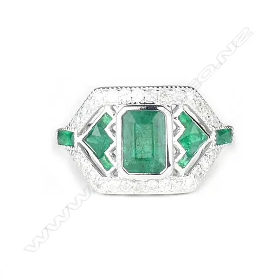 An 18ct. white gold emerald and diamond Art Deco style ring