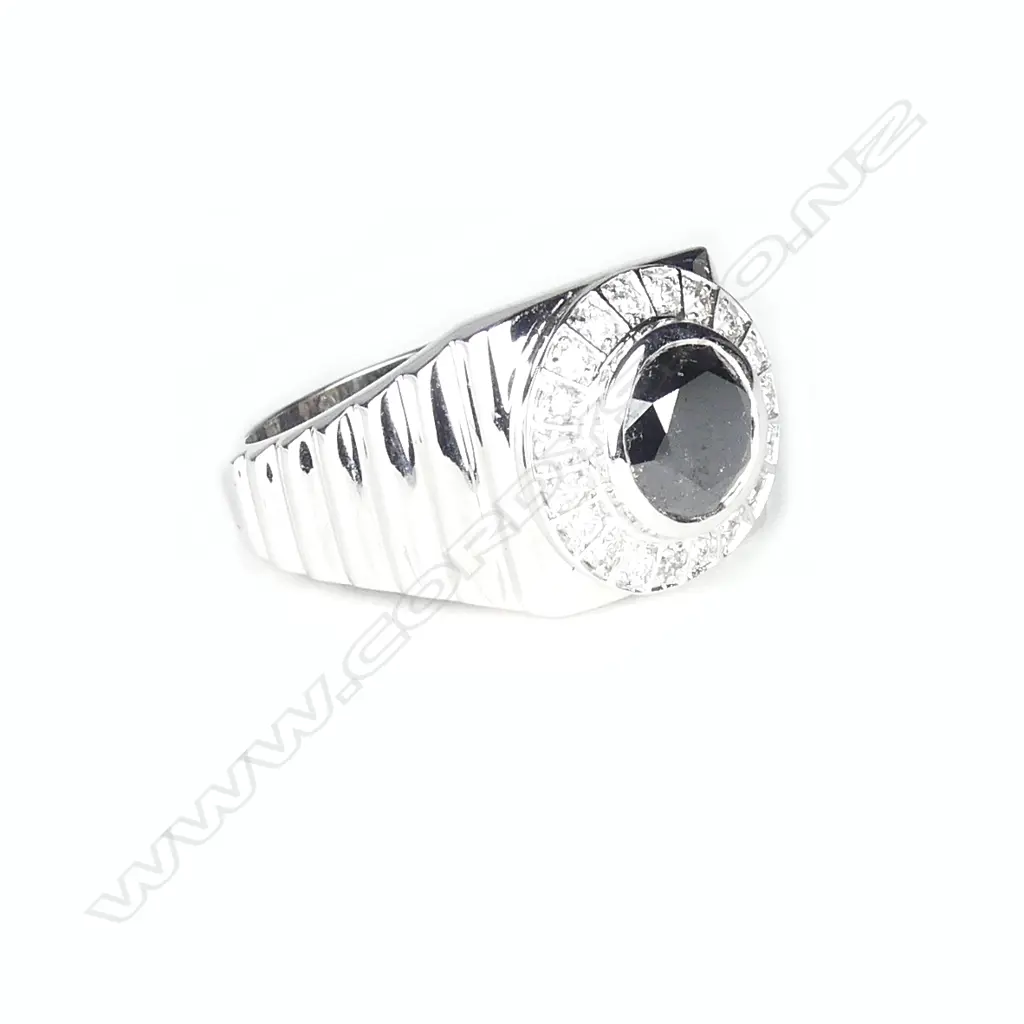 A 14ct. white gold and diamond gent's ring Image 1++