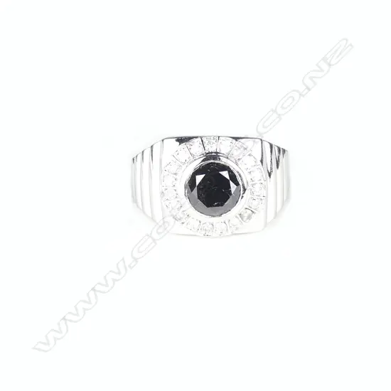 A 14ct. white gold and diamond gent's ring