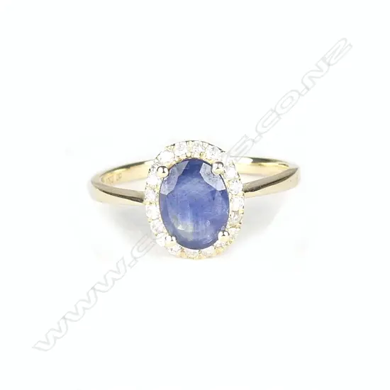 A 14ct. yellow gold sapphire and diamond ring