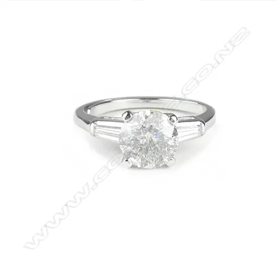 A platinum and diamond solitaire ring