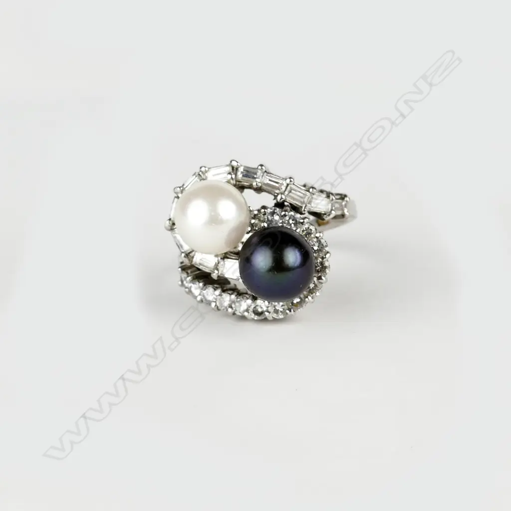 An impressive 14ct. white gold diamond and pearl ring and earrings suite Image 1++
