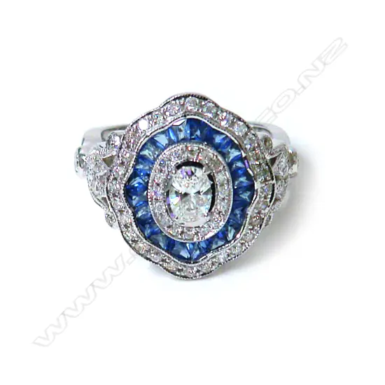 A modern Belle Époque-style 18ct. white gold sapphire and diamond cluster ring