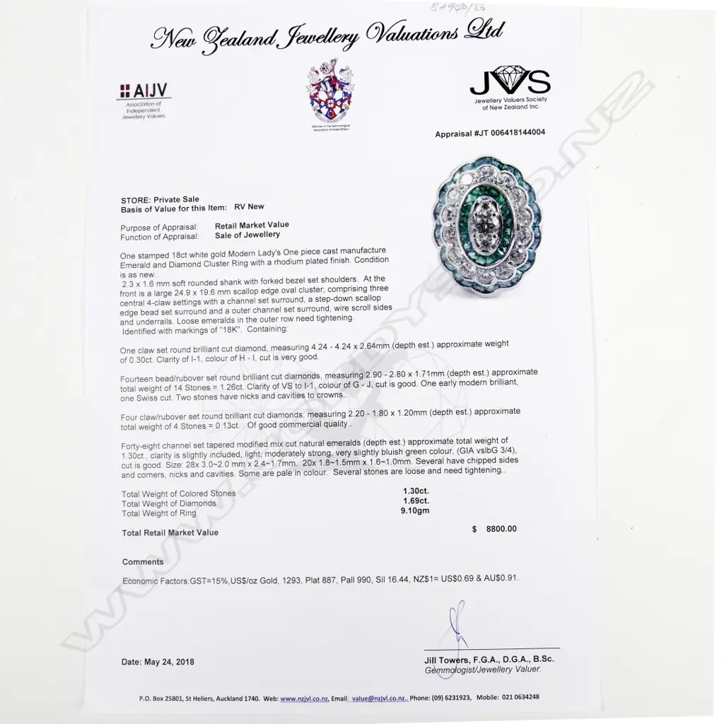 An 18ct. white gold emerald and diamond ring Image 1++