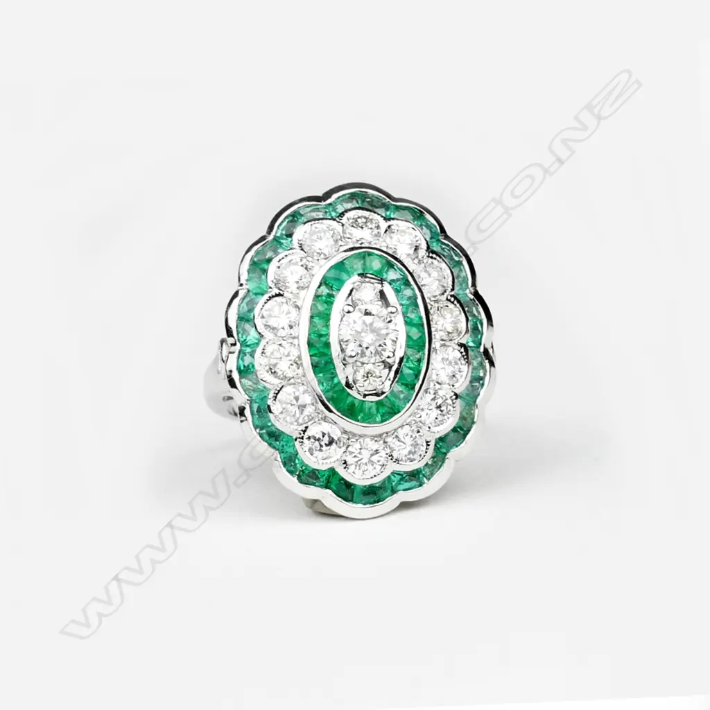 An 18ct. white gold emerald and diamond ring Image 1++