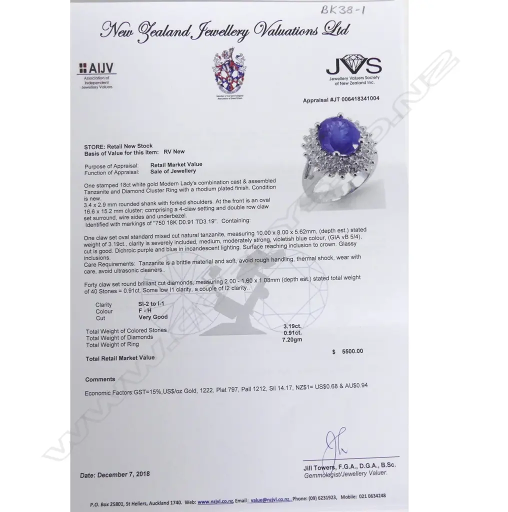 An 18ct. white gold tanzanite and diamond ring Image 1++