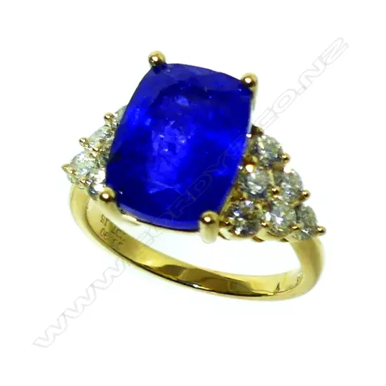 An 18ct. gold tanzanite and diamond ring
