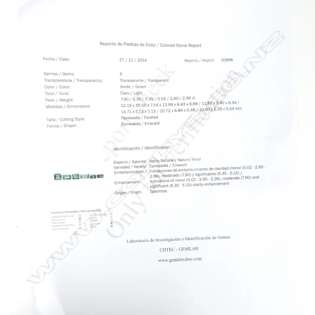 A good modern 18ct. yellow and white gold emerald and diamond dress ring Image 1++